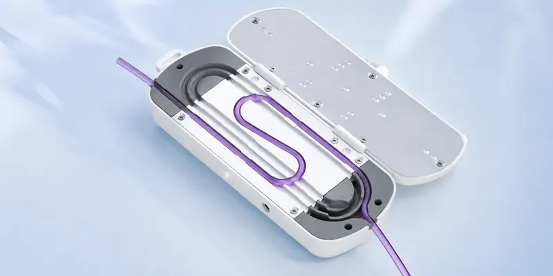 Close-up of IV tubing properly installed in HF-110C heating path